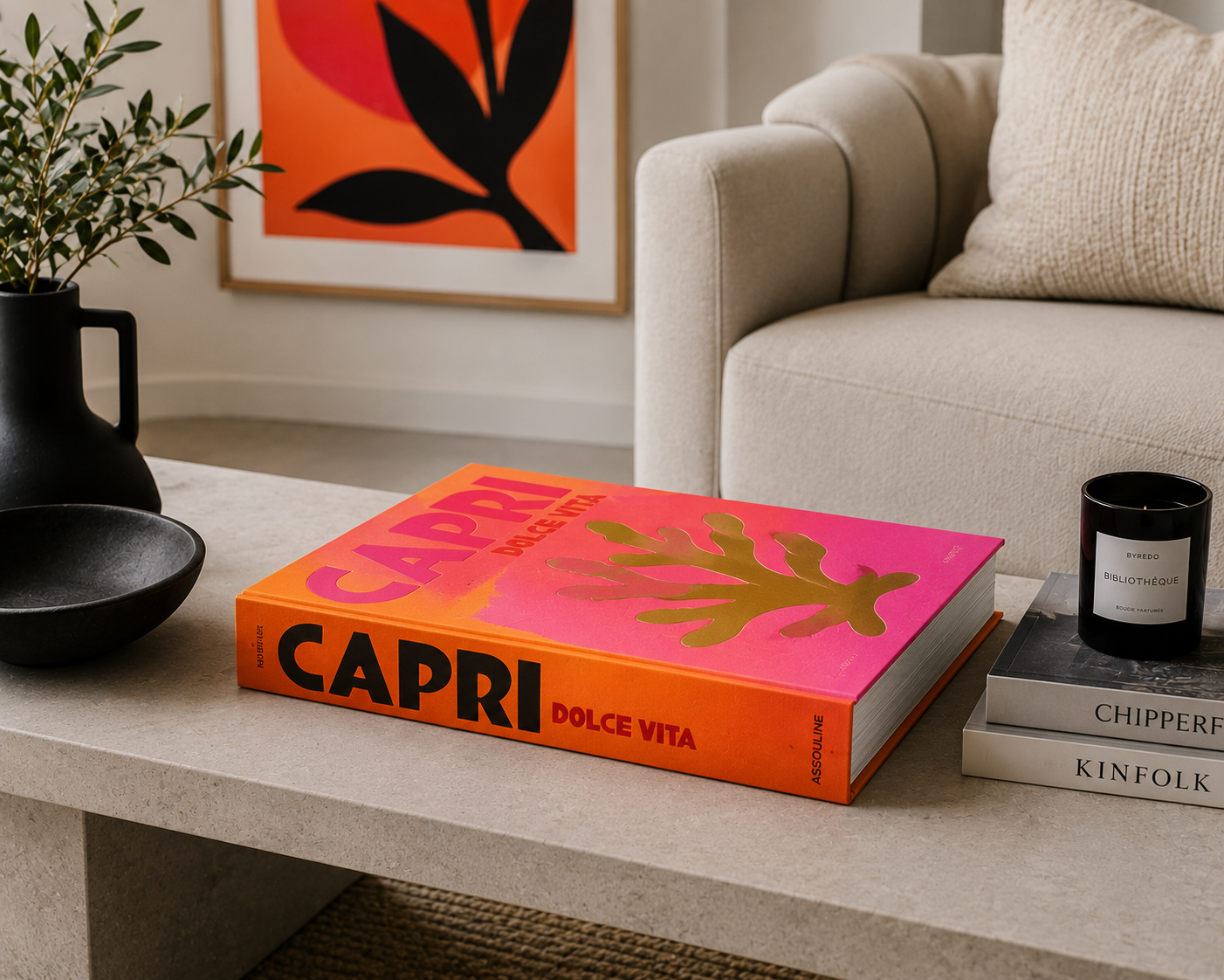 A bold and colourful coffee table book taking centre stage on a minimalist table, adding a touch of personality to the room.