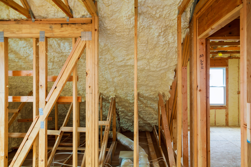Cross-section view of a loft with insulation materials and soundproofing layers