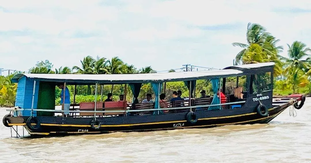 Boat traveling on the Mekong Delta Vietnam