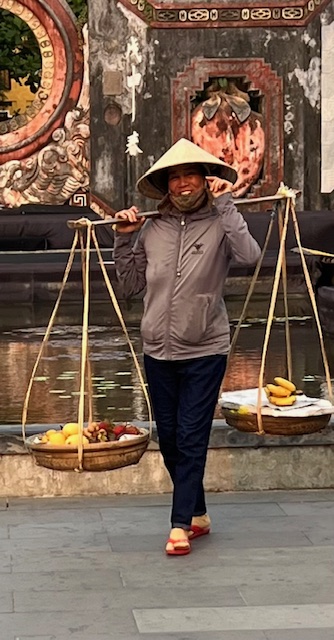 Southeast Asia Food being carried by Vietnamese Woman, Travel to Southeast Asia