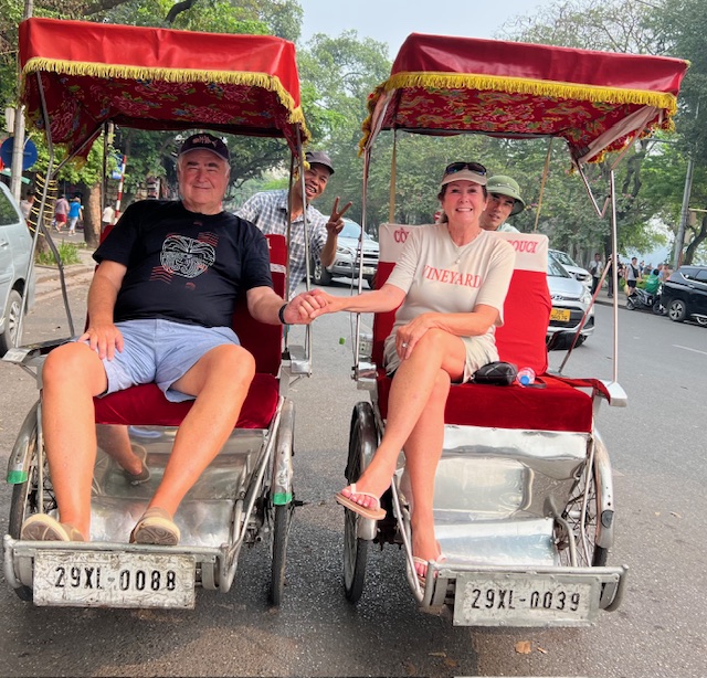 travel to Southeast Asia: Cos and Robin getting a ride in Hanoi