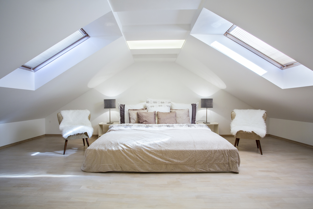 Built-in shelves and under-bed storage in a compact loft bedroom