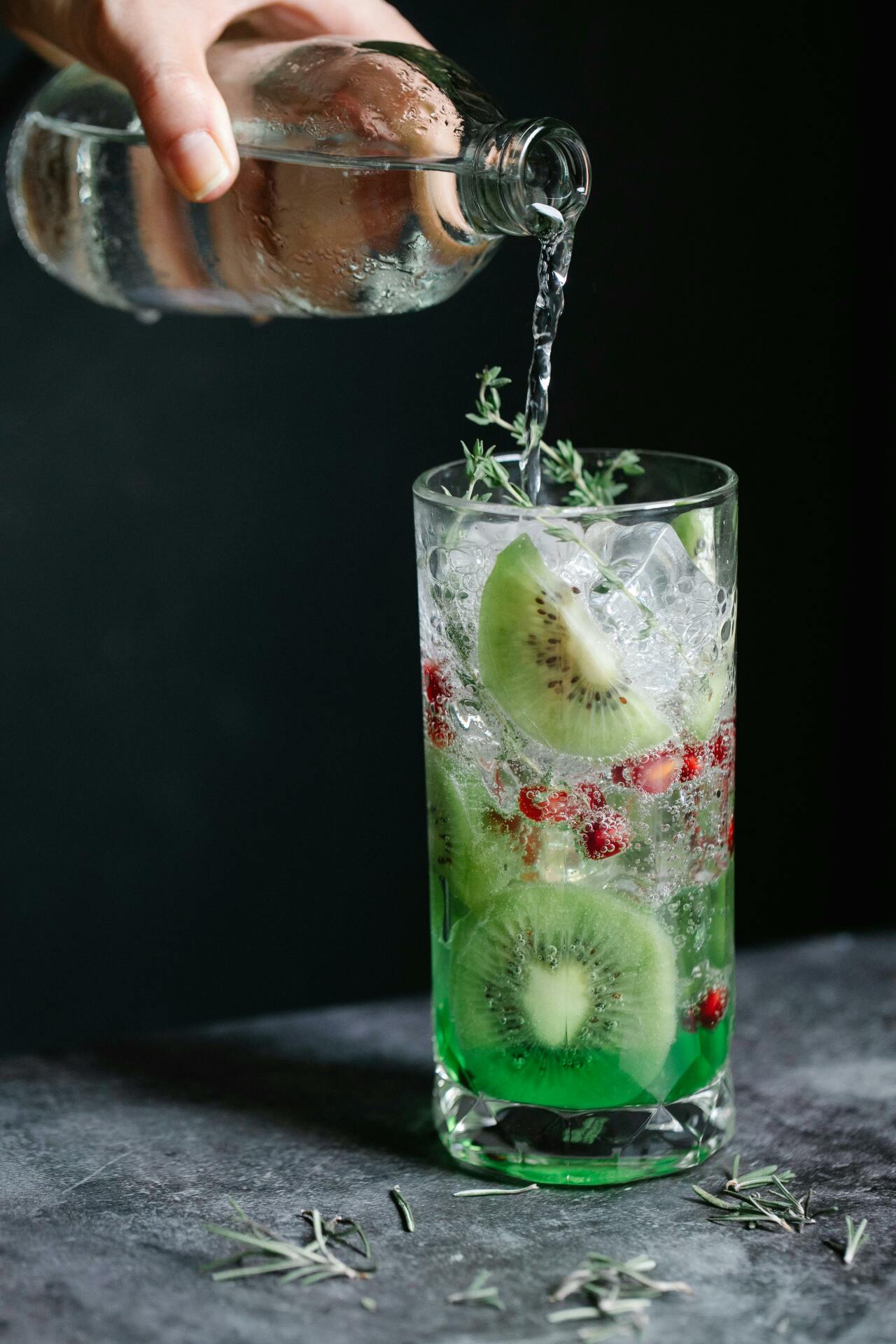 Juxtaposition of traditional alcoholic gin and its alcohol-free alternative, highlighting reasons for choosing the latter.