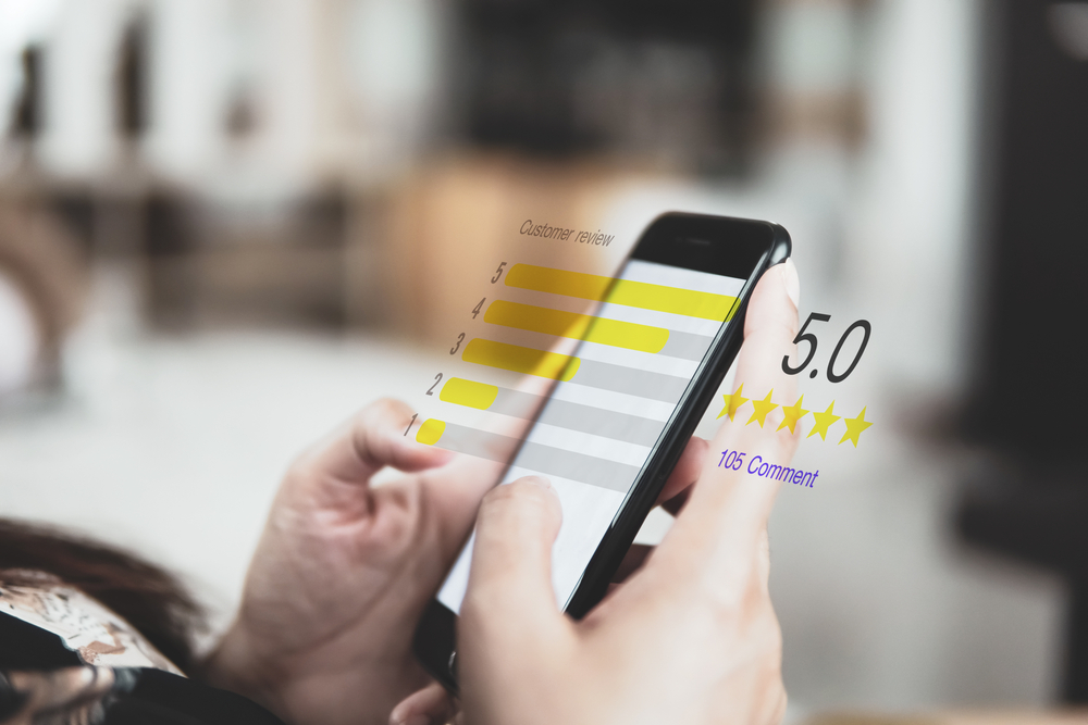 Smartphone displaying positive customer reviews for a Blackburn locksmith on a review app